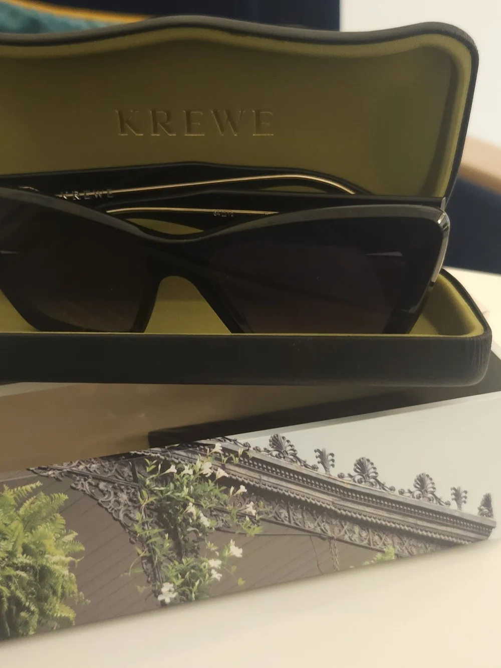 KREWE Black Cat-Eye Sunglasses with Gold Temples and Gradient Lenses